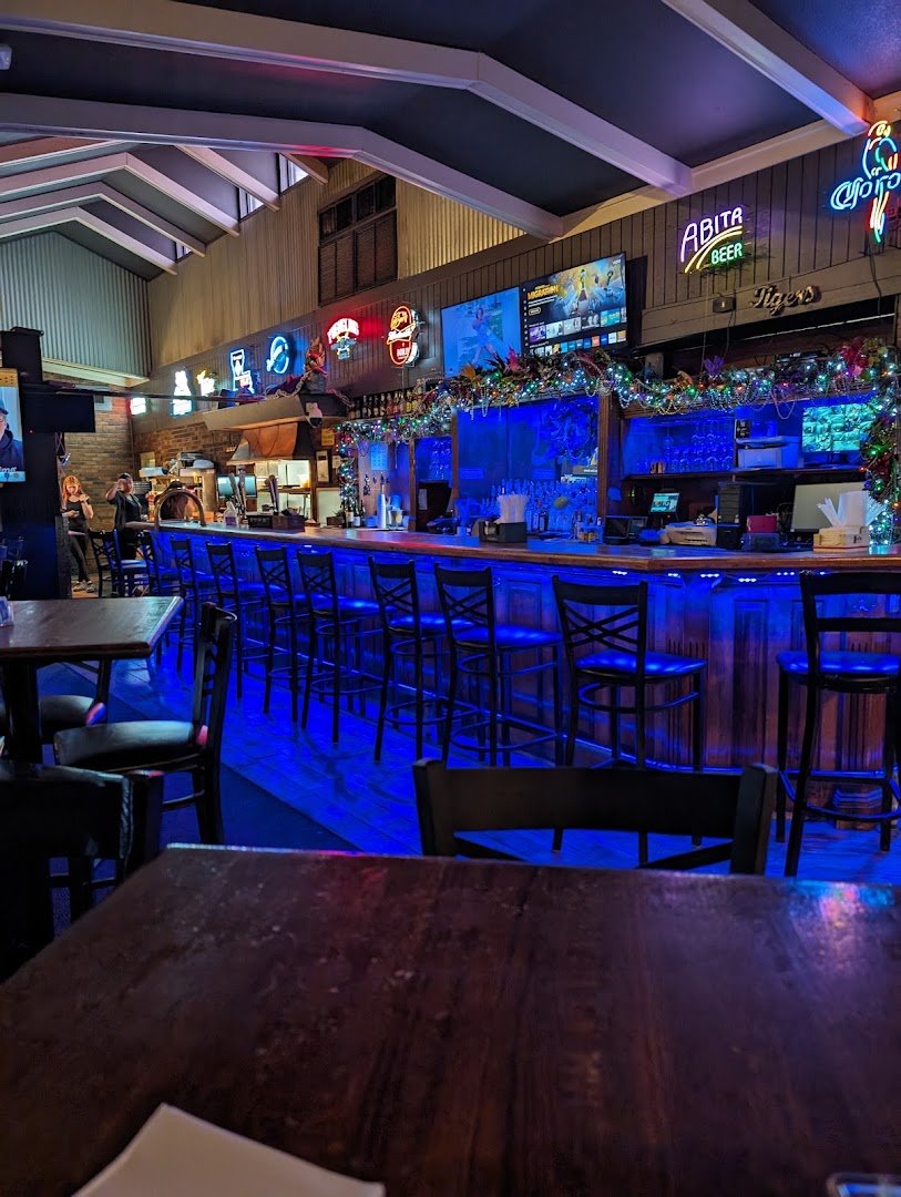 Restaurant dining area with pub-style booths.